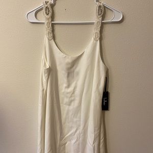 Brand: Lulu’s. Size: M. Color: Silver and white.